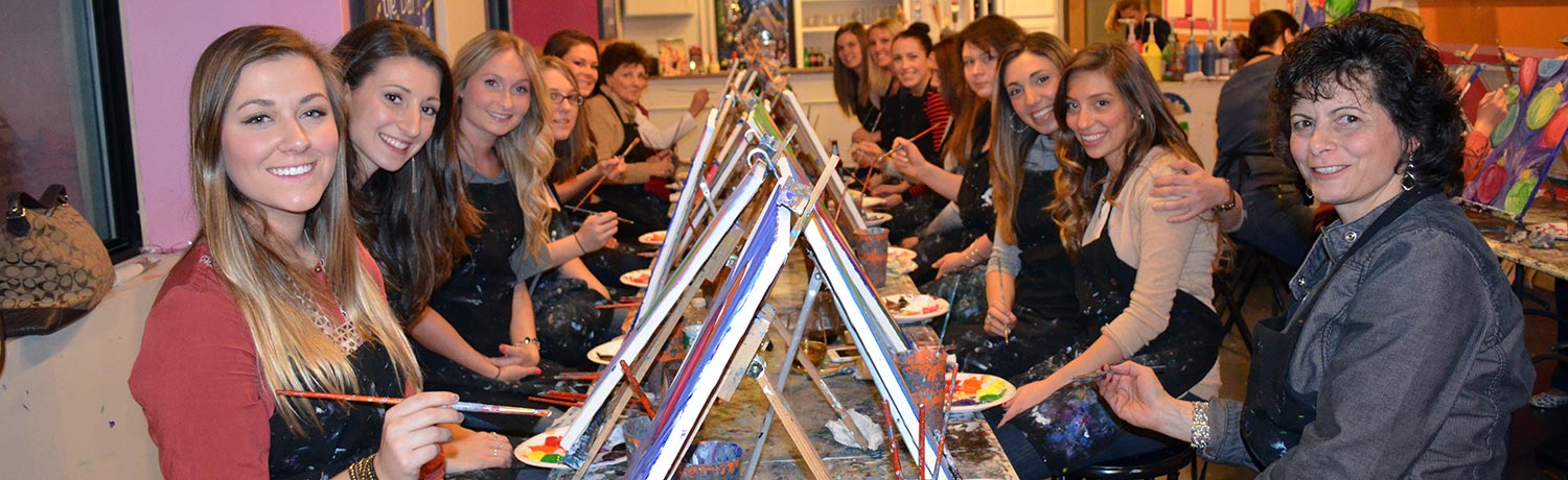 a group of women painting masterpieces that can be shared in the Paint & Sip Gallery