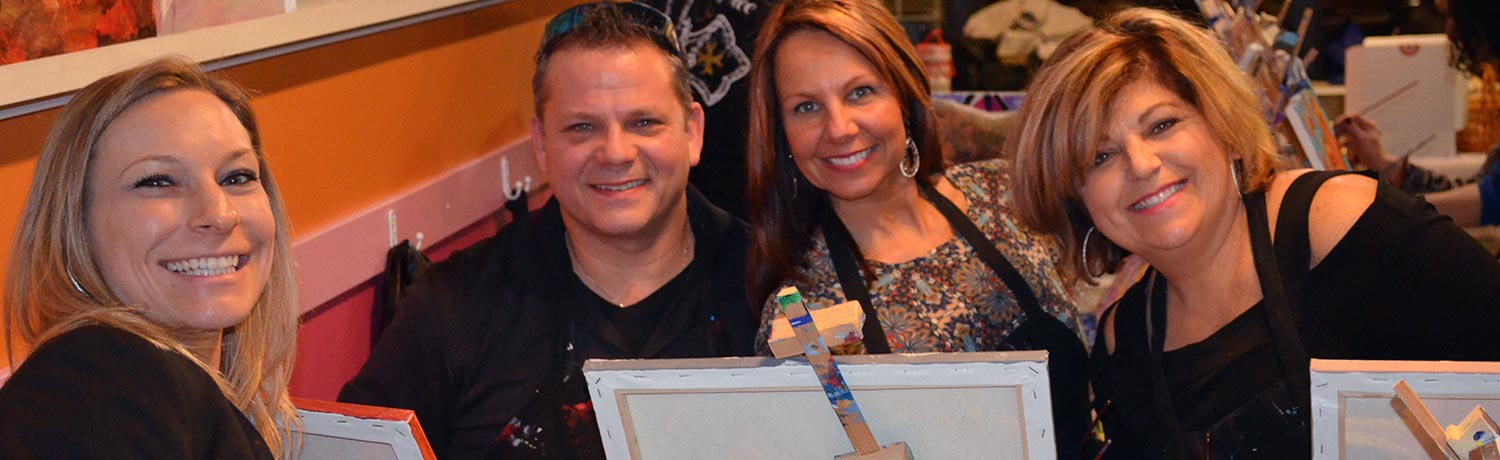 three women and a man at a Paint & Sip Party
