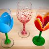 three painted wine glasses