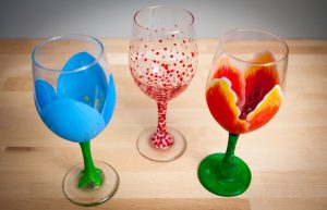 three painted wine glasses